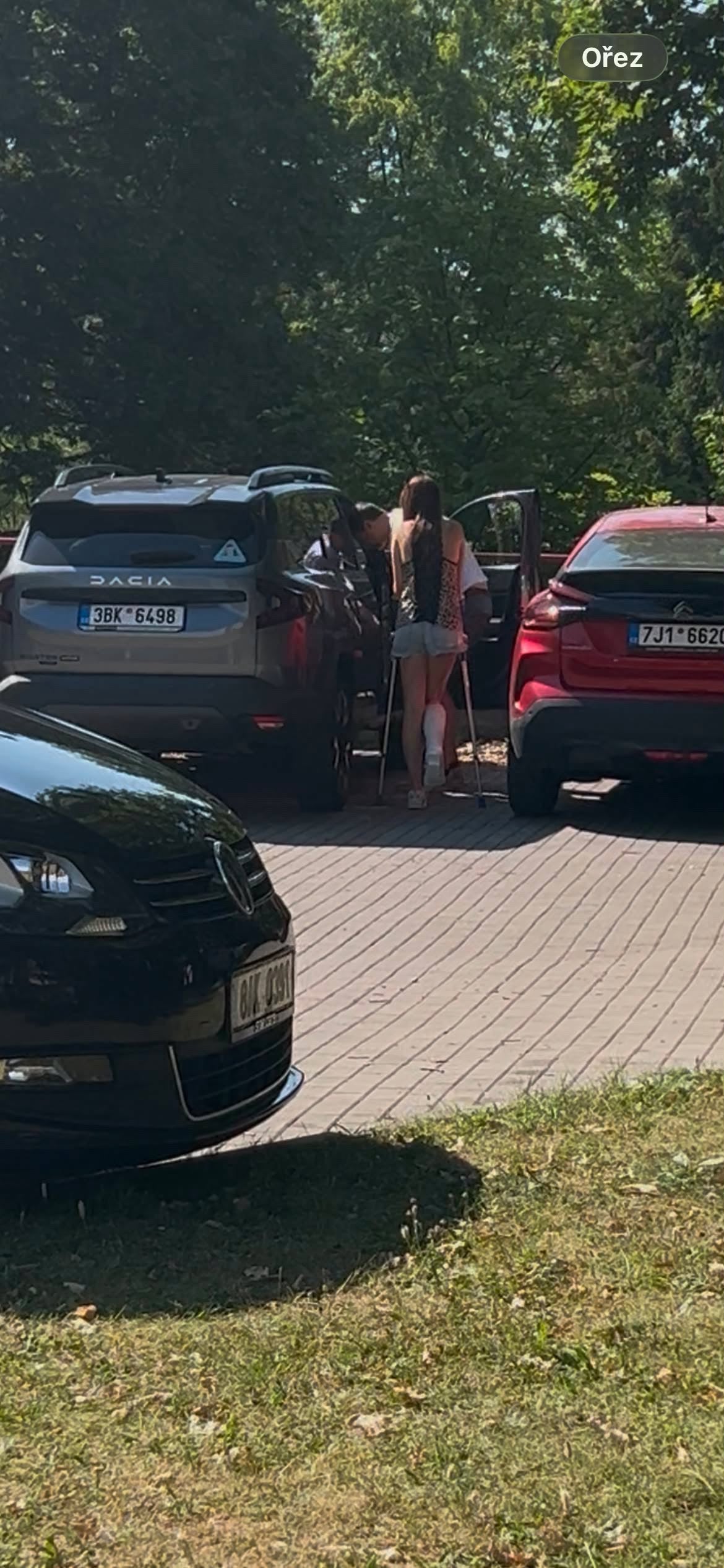 Girl slwc leaving hospital by car