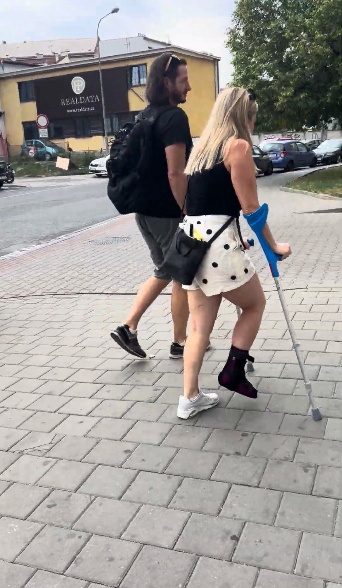 Woman braced ankle crutching video